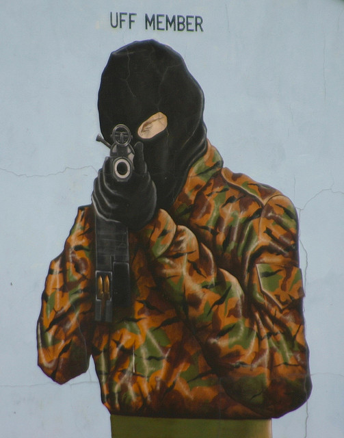 "Gunman Mural" CC Licenced by Still Burning (Flickr)